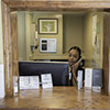 San Francisco - staff member at front desk answering phone call