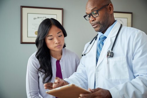 doctor and patient review medical results.