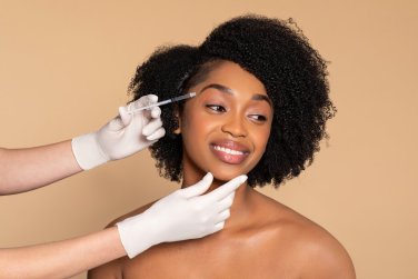woman receiving Botox treatment.
