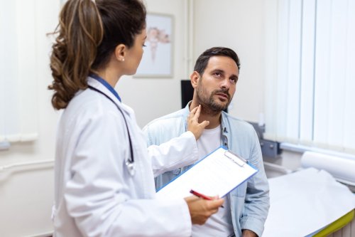 provider examining patient's throat.